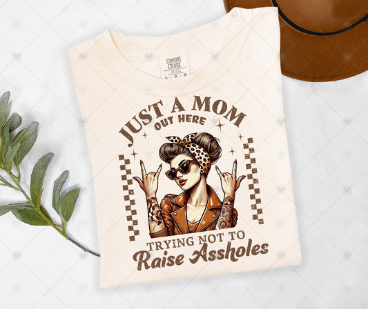 JUST A MOM OUT HERE TRYING NOT TO RAISE ASS*OLES | DTF TRANSFER - 1494